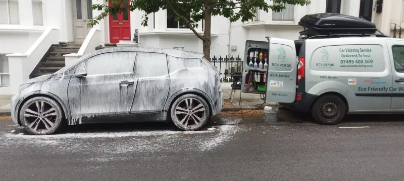 Eco-friendly snow foam car wash beside the Ecoverde van